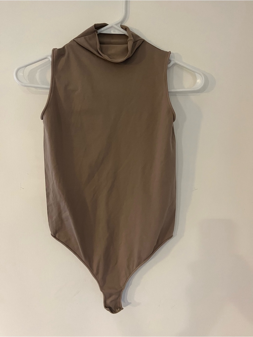 SKIMS Sleeveless High-Neck One-Piece Bodysuit in Taupe